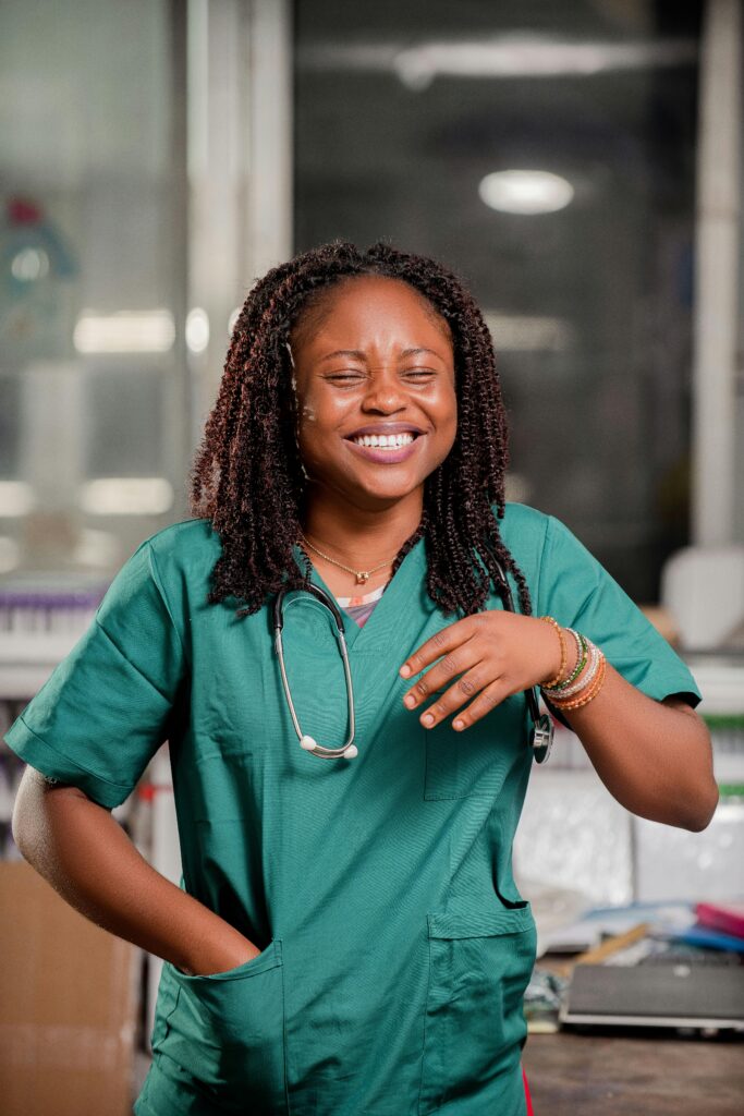 pexels photo 18844981 18844981 Smiling healthcare worker with stethoscope in a clinic setting, representing positivity and professionalism.