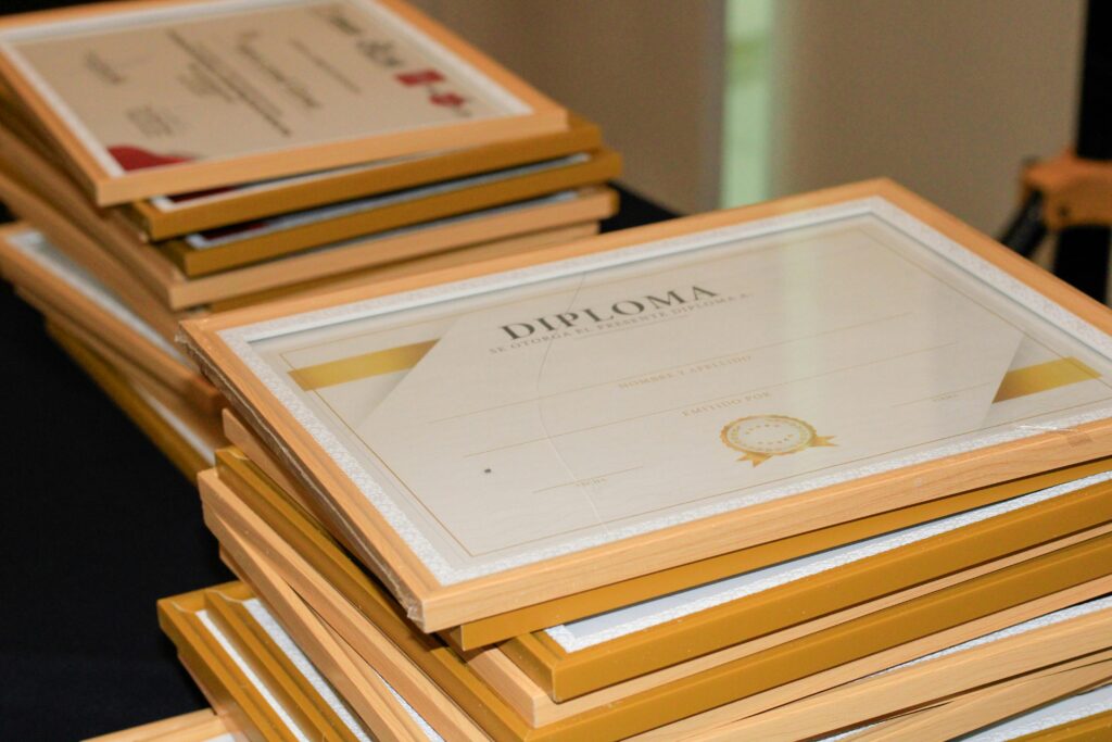 pexels photo 37012315 37012315 A stack of elegant framed diplomas prepared for an academic ceremony.